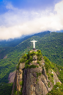 View of the Christ statue (Cristo Redactor) on Corcovado with Tijuca National Park behind, Rio de Janeiro, Brazil, South America