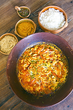 Seafood moqueca, a traditional Bahian dish, served with vatapa, rice and manioc farofa, Bahia, Brazil, South America