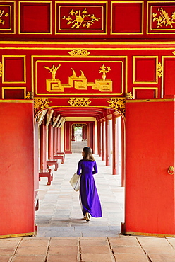 A woman in a traditional Ao Dai dress in the Forbidden Purple City of Hue, UNESCO World Heritage Site, Thua Thien Hue, Vietnam, Indochina, Southeast Asia, Asia