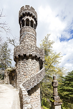 Old mystical tower of Romanesque Gothic and Renaissance style inside the park Quinta da Regaleira, Sintra, Portugal, Europe