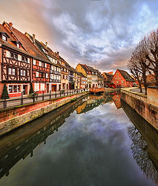 Panorama of colored houses reflected in River Lauch at sunset, Petite Venise, Colmar, Haut-Rhin department, Alsace, France, Europe