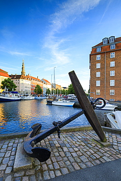 Sculpture of an anchor on the banks of Christianshavn Canal with Church of Our Saviour in the background, Copenhagen, Denmark, Europe