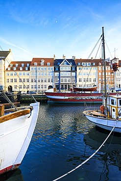 Boats in Christianshavn Canal with typical colorful houses in the background, Copenhagen, Denmark, Europe