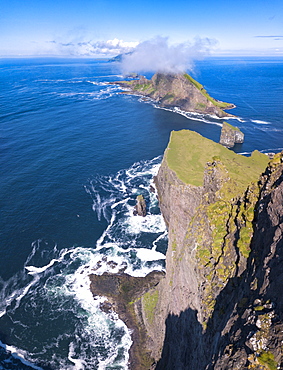 Panoramic of the sea stacks of Drangarnir and Tindholmur islet, Vagar Island, Faroe Islands, Denmark, Europe (Drone)