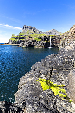 Cliffs around Mulafossur Waterfall in summer, Gasadalur, Vagar Island, Faroe Islands, Denmark, Europe