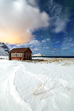 House surrounded by snow in a cold winter day, Flakstad, Lofoten Islands, Arctic, Norway, Scandinavia, Europe