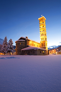 Dusk and lights on the church surrounded by snow Sankt Moritz, Engadine, Canton of Grisons (Graubunden), Switzerland, Europe