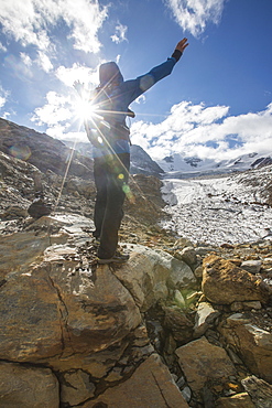 Hiker admires Forni Glacier, Cedec Valley, Stelvio National Park, Valtellina, Lombardy, Italy, Europe