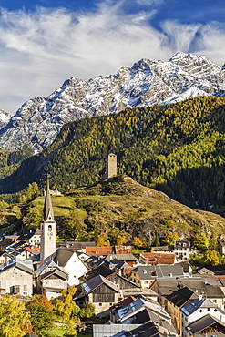 View of Ardez village surrounded by woods and snowy peaks, Lower Engadine, Canton of Graubunden, Switzerland, Europe