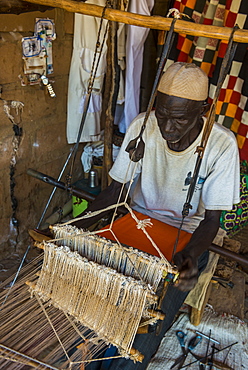 Man weaving on a traditional loom in the National Museum, Niamey, Niger, Africa