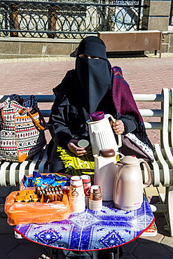 Woman selling arabian coffee, Abha, Saudi Arabia, Middle East