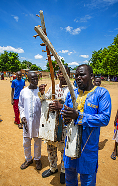 Man playing a local instrument at a tribal festival, Southern Chad, Africa