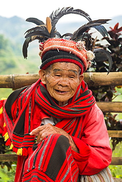 Portrait of an old person in traditional clothes and feathered hat, Banaue, Luzon, Philippines, Southeast Asia, Asia