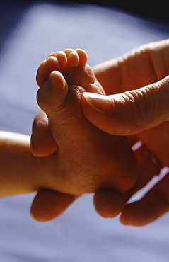 Baby foot, hand and foot, feet, close up of toes, mother and child, affection