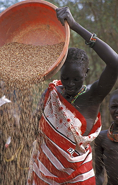 South sudan woman cleaning grain, toposa tribals at nanyangacor