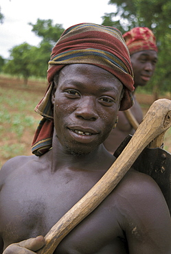 Ghana farmer holding a hoe for digging bongo, bolgatanga (north ghana)