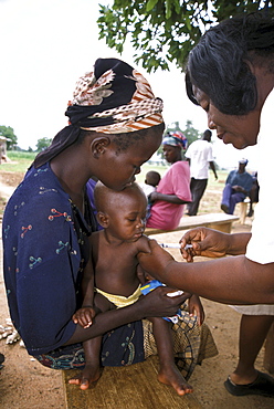 Ghana child receiving immunisation at a mother/child health clinic bongo, bolgatanga