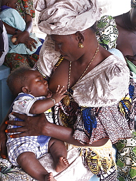 Gambia woman and waiting at clinic birkana