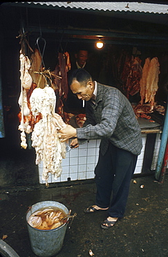 Taiwan cutting at a butchers stall taipai