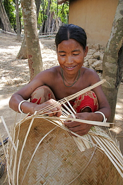 Bangladesh member of koch tribal minority making a bamboo basket, nalitabari, mymensingh region