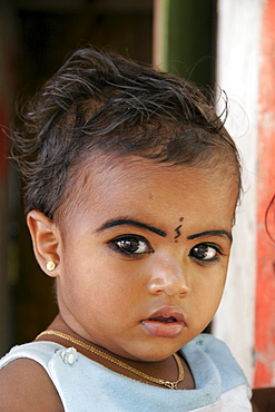 India visits to post, tsunami site in srayickadu kollom, kerala, where cnewa funds relief efforts through the social services office of the syro, malankar church. A child who survived the tsunami.