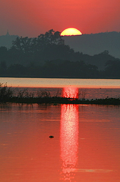 Myanmar sunset over lake at mandalay 