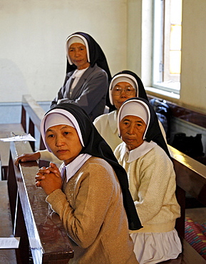 Myanmar nuns attending catholic wedding of tribal kachins at myitkyina, a largely kachin community in north burma near chinese border 