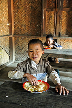 Myanmar eating meal in school, myitkyina, a largely kachin community in north burma near chinese border 