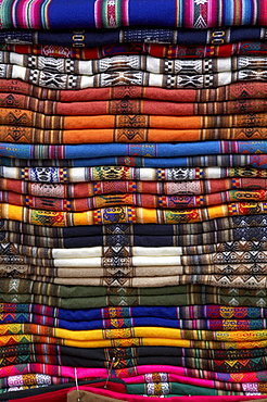 Bolivia. Pile of weavings at a shop of la paz