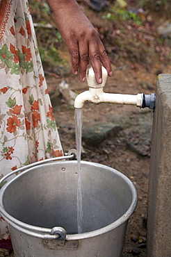 India. Rainwater harvesting project in villages of kozhikode district, thamarassery diocese centre for overall development (cod). Individual houses are equipped with rain gutters and a pipe which fills a 10,000 litre concrete tank. Funded by cnewa. Kerala. Home of thresiamma thomas (mother), thomas venkitakkal (father) and neethu thomas (18). 2007   