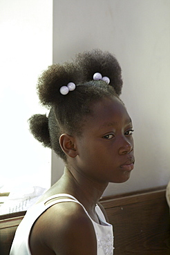 Jamaica. Girl at sunday mass at catholic church in chester castle