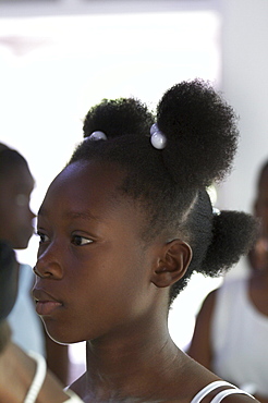 Jamaica. Girl at sunday mass at catholic church in chester castle