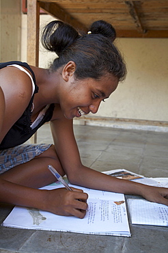 East timor. Girl studying, topu honis orphanage and childrens home, oecussi-amben