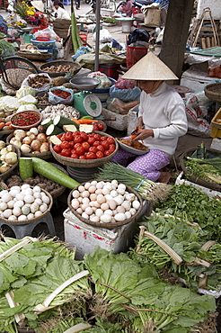 Vietnam woman selling fruit, vegetables and eggs, hoi an