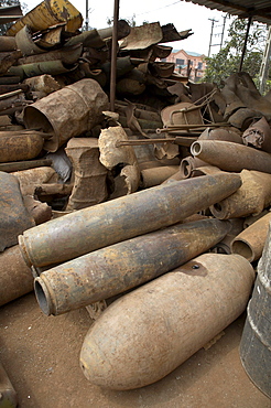 Vietnam unexploded ordnance, both bombs dropped by americans and land mines laid by both sides during the vietnam war, remain a big problem in central vietnam for children and adults alike. in response, crs has implemented a mine risk education program in quang tri province near the former khe sanh battlefield. this image shows the yard of a scrap metal merchant in tan hop. 80% of the steel comes from bombs, either exploded or unexploded. collecting and selling scarp metal has for long been an income for many poor people in the area