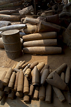 Vietnam unexploded ordnance, both bombs dropped by americans and land mines laid by both sides during the vietnam war, remain a big problem in central vietnam for children and adults alike. in response, crs has implemented a mine risk education program in quang tri province near the former khe sanh battlefield. this image shows the yard of a scrap metal merchant in tan hop. 80% of the steel comes from bombs, either exploded or unexploded. collecting and selling scarp metal has for long been an income for many poor people in the area