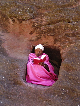 Religion, ethiopia. Monk (in pink, abba gebra kidan) staying in the caves near the churches of lalibela