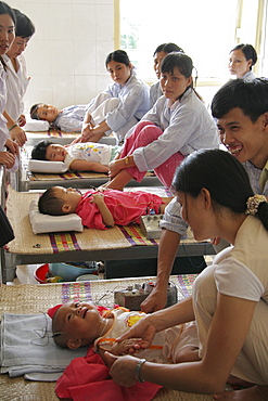 Vietnam child receiving acupuncture treatment at hospital in hanoi