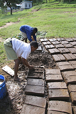 Tanzanian school boys making mud bricks. Kisangara, same, in the north-east near kilimanjaro