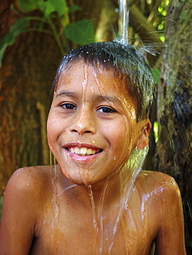 Honduras boy taking a bath, agua caliente, near copan