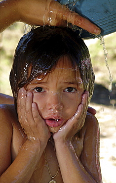 Honduras girl taking a bath, agua caliente, copan