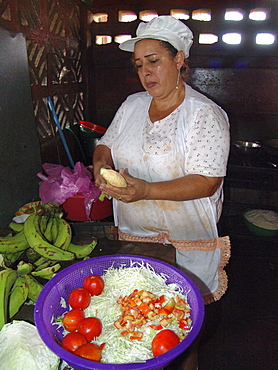 Nicaragua woman preparing food in her small local restaurant, managua