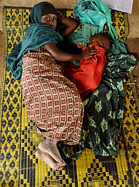 Kenya,dadaab refugees camp, somalian border gtz hospital ,the camps were set up around the town of dadaab beginning in 1991 when civil wars erupted on a grand scale in somalia (16 rival factions were involved). The wars, along with a prolonged drought, forced more than 900,000 somalis to flee to neighboring countries. Approximately 400,000 of them, many of whom were in a serious state of exhaustion and starvation, took refuge in kenya. Since then, a majority have returned to their country. However, some 131,000 somalis remain in kenya, and 110,000 are in dadaab, along with some sudanese, ugandans, and about 3,000 ethiopians women waiting the receive care from gtz ngo at the local hospital 