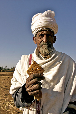 Old man, priest, in walking in the different villages of the hanamerant area,meket,ethiopia. He is people on his way . Ehtiopians are mainly christians with strong believe in angels. Ethiopia