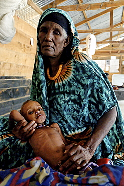 Kenya,dadaab refugees camp, somalian border gtz hospital ,the camps were set up around the town of dadaab beginning in 1991 when civil wars erupted on a grand scale in somalia (16 rival factions were involved). The wars, along with a prolonged drought, forced more than 900,000 somalis to flee to neighboring countries. Approximately 400,000 of them, many of whom were in a serious state of exhaustion and starvation, took refuge in kenya. Since then, a majority have returned to their country. However, some 131,000 somalis remain in kenya, and 110,000 are in dadaab, along with some sudanese, ugandans, and about 3,000 ethiopians women waiting the receive care from gtz ngo at the local hospital 