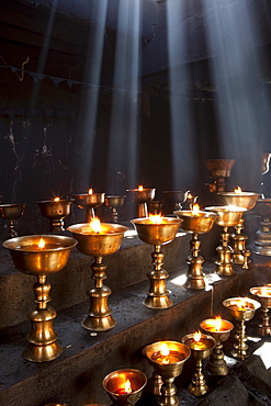 Oil lamps lit at Shey Gompa by families wishing to bear children. Ladakh, India