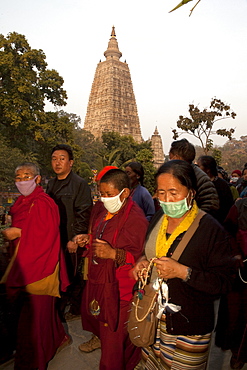 Buddhist pilgrims circumambulate maha bodhi temple in bodhgaya. Kalachakra initiation in bodhgaya, india  