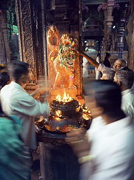 Worshippers at a shrine inside the Sri Meenakshi Temple, Madurai, Tamil Nadu state, India, Asia