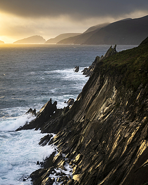 Cliffs of Coumeenoole Beach at sunset, Dingle Peninsula, County Kerry, Munster, Republic of Ireland