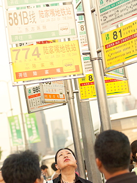 Commuters waiting for buses, Shanghai, China, Asia